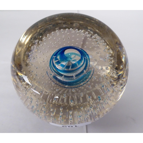 131 - A vintage Whitefriars glass doorstop of domed, clear, bubbled form, decorated on the interior with a... 