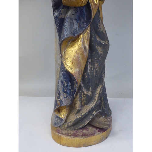 133 - A 19thC carved and painted wooden figure 'St Lucy, Patron Saint of Sight and Sufferers of Eye Diseas... 