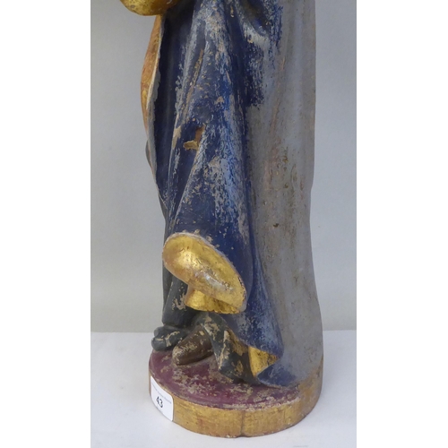 133 - A 19thC carved and painted wooden figure 'St Lucy, Patron Saint of Sight and Sufferers of Eye Diseas... 