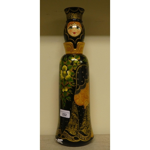 222 - A Russian turned and painted softwood bottle vase, featuring a young woman wearing traditional costu... 