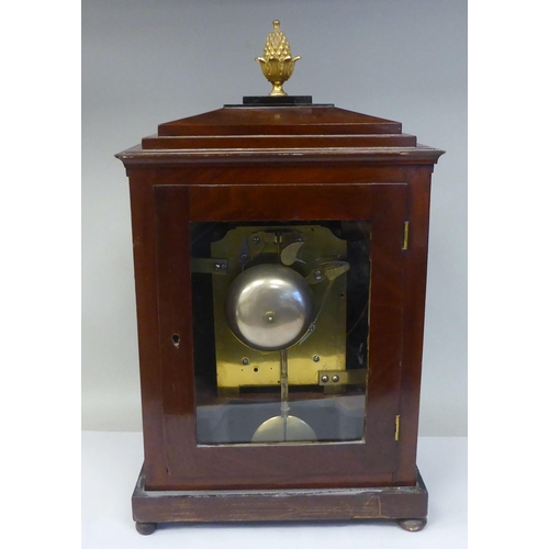 287 - A George III mahogany cased bracket clock with a stepped top, gilt metal pineapple finial and brass ... 