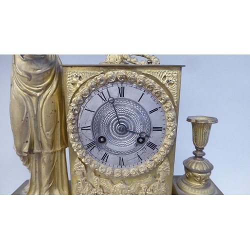 293 - A late 19thC Continental gilded metal cased mantel clock, ornamented with a standing classical maide... 