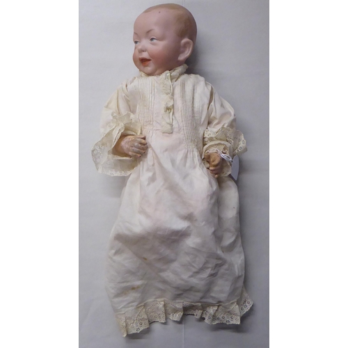 1 - An early 20thC Kammer & Reinhart 100 Kaiser Baby bisque head doll with painted features, on a jo... 