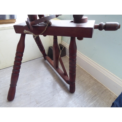 101 - A 20thC stained pine spinning wheel  46