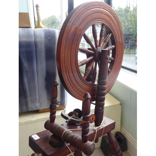 101 - A 20thC stained pine spinning wheel  46