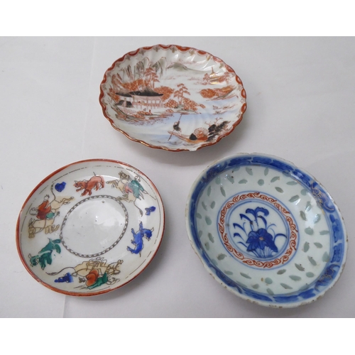 102 - Oriental collectables: to include a mid 20thC enamel lidded bowl, on a saucer