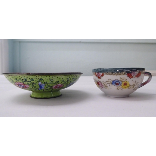 102 - Oriental collectables: to include a mid 20thC enamel lidded bowl, on a saucer