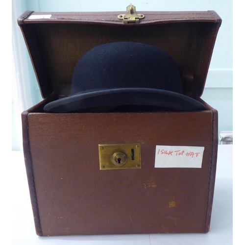 114 - A Colletts of London black silk top hat  8