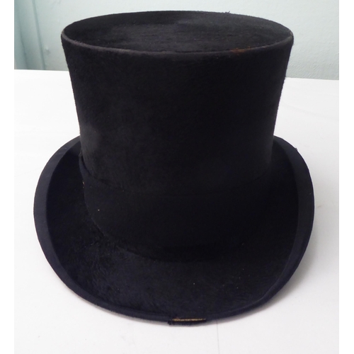 114 - A Colletts of London black silk top hat  8