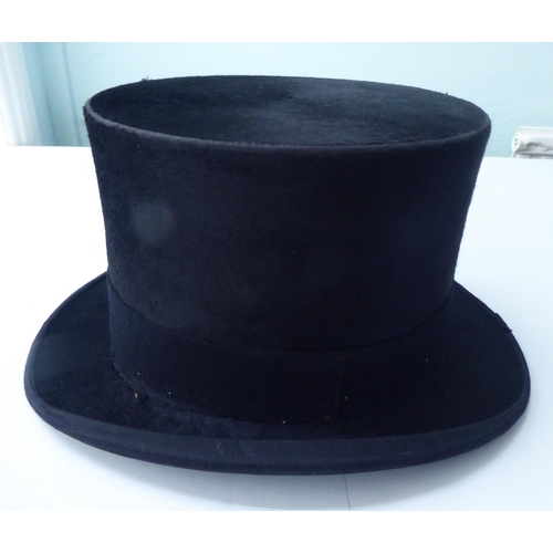 114 - A Colletts of London black silk top hat  8