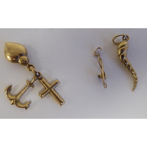 116 - 9ct gold charm bracelet accessories: to include examples fashioned as hearts; and an anchor 