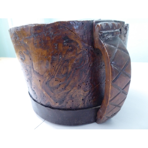 117 - An 18thC (possibly German) rustically constructed walnut handled vessel