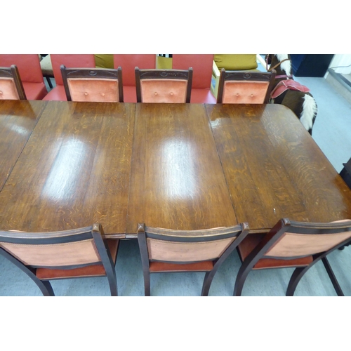 159 - A late Victorian oak dining table, the top with  thumb moulded edge, raised on turned, tapered legs ... 