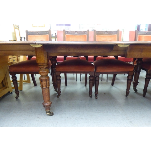 159 - A late Victorian oak dining table, the top with  thumb moulded edge, raised on turned, tapered legs ... 