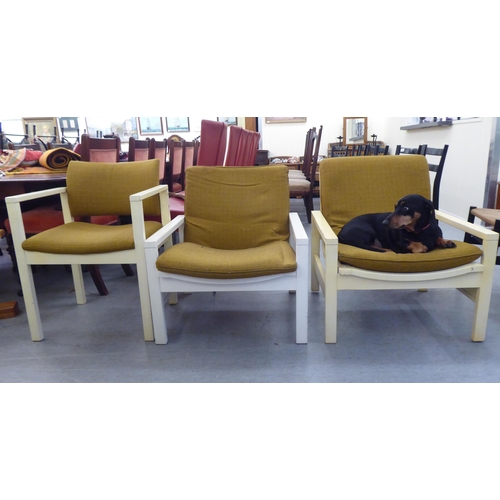 167 - Three 1960s Cornwell-Norton cream painted open arm chairs with original contemporary mustard coloure... 