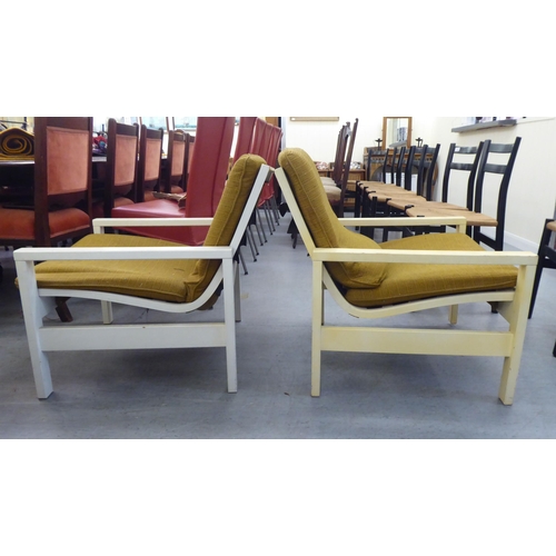 167 - Three 1960s Cornwell-Norton cream painted open arm chairs with original contemporary mustard coloure... 