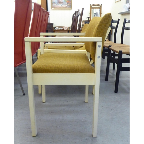 167 - Three 1960s Cornwell-Norton cream painted open arm chairs with original contemporary mustard coloure... 