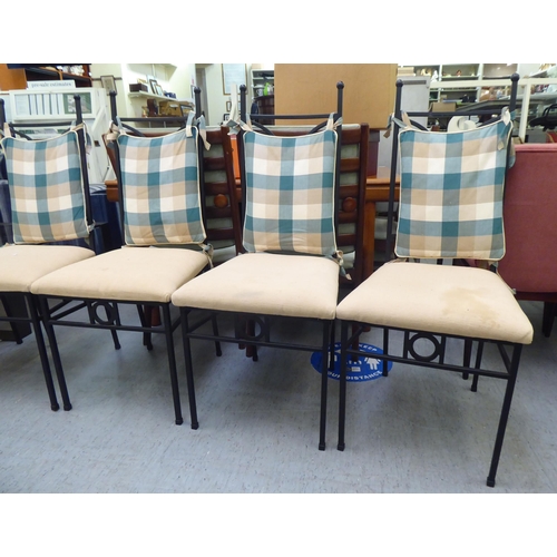 17 - A set of eight modern black painted metal framed conservatory chairs, the fabric upholstered seats r... 