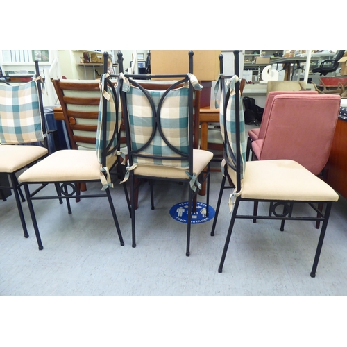 17 - A set of eight modern black painted metal framed conservatory chairs, the fabric upholstered seats r... 