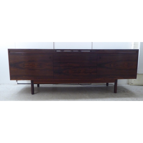 179 - Attributed to Robert Heritage for Archie Shine, a 1960s rosewood sideboard, the top with a rising an... 