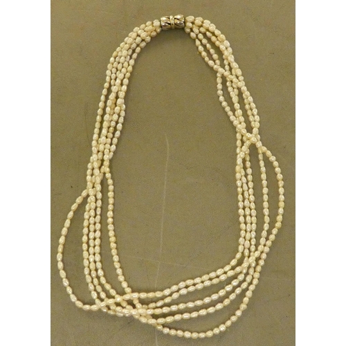 180 - A freshwater pearl necklace, consisting of five strands, connected by a white metal clasp  stam... 