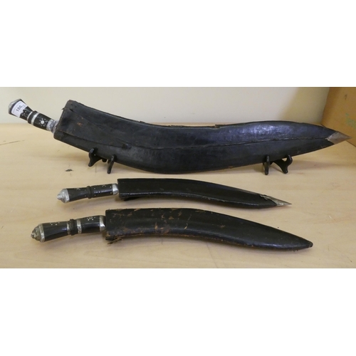 186 - Three Kukris with horn handles  largest blade 22