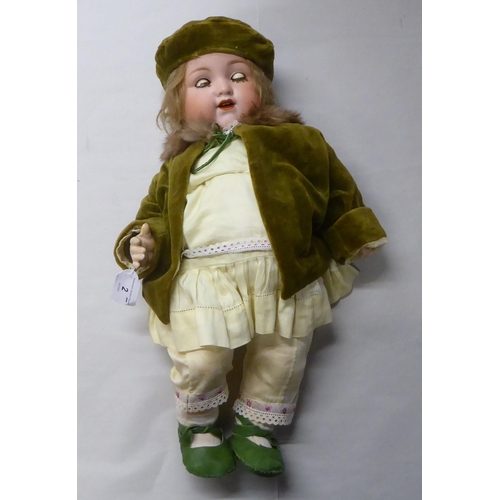 2 - An early 20thC Armand Marseille 990 bisque head doll with painted features, on a jointed compos... 