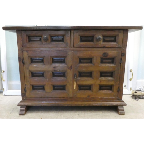 202 - A modern traditional Old English style oak sideboard with two frieze drawers, over two panelled door... 