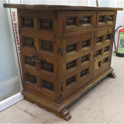 202 - A modern traditional Old English style oak sideboard with two frieze drawers, over two panelled door... 