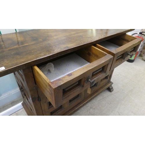 202 - A modern traditional Old English style oak sideboard with two frieze drawers, over two panelled door... 