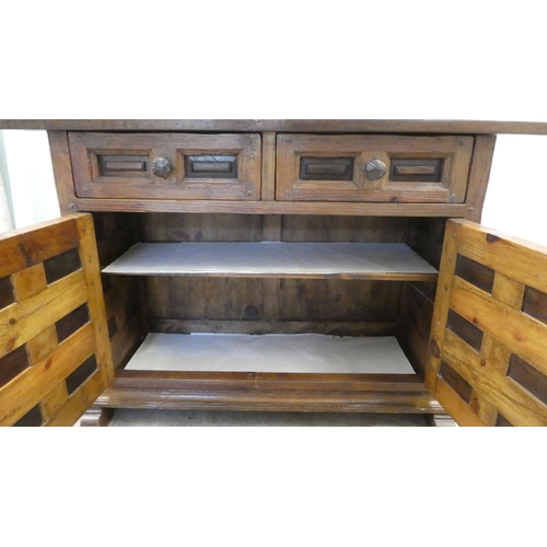 202 - A modern traditional Old English style oak sideboard with two frieze drawers, over two panelled door... 