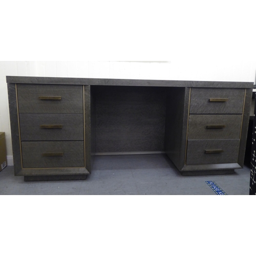 207 - A modern grey maple effect, veneered oak six drawer dressing table, on a plinth  31