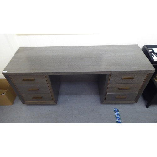 207 - A modern grey maple effect, veneered oak six drawer dressing table, on a plinth  31