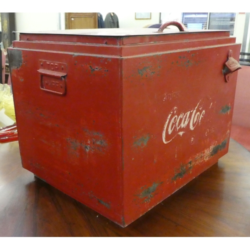 226 - A modern cast and red painted metal bound cool box, branded for 'Coca-Cola'  15