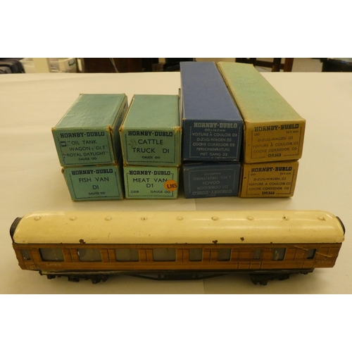 229 - Four Hornby 00 gauge tinplate passenger coaches  boxed; another unboxed example; and four goods... 