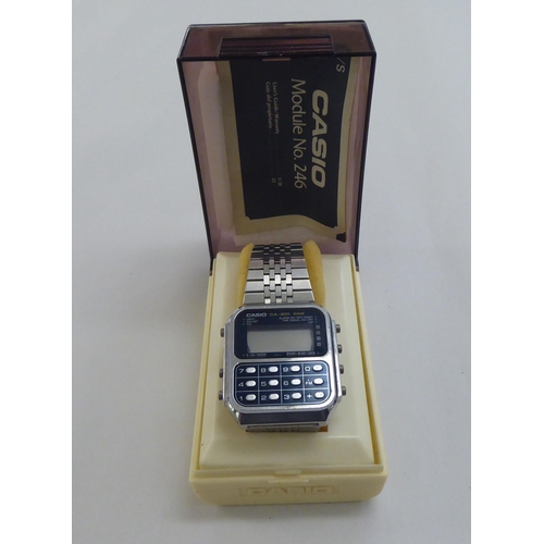 230 - A Casio CA-901 stainless steel cased calculator bracelet watch