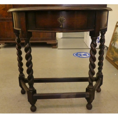 245 - A 1930s oak demi-lune single drawer side table, raised on barleytwist legs  34