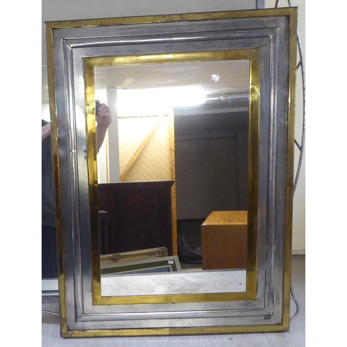 25 - Two modern mirrors, set in metal frames  33