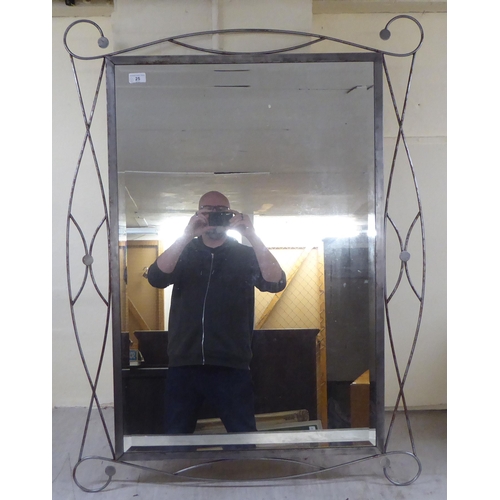 25 - Two modern mirrors, set in metal frames  33