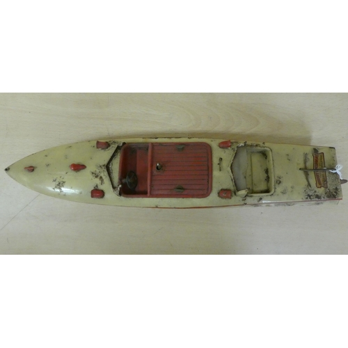 251 - A Hornby tinplate clockwork model, a Racer III speed boat  17