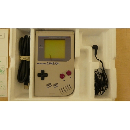 257 - A Game Boy with various games