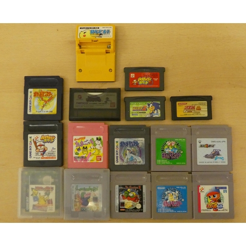 257 - A Game Boy with various games