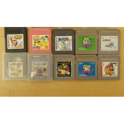 257 - A Game Boy with various games