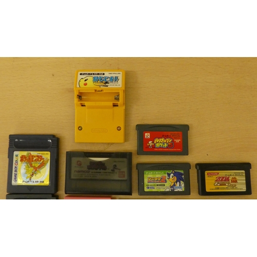 257 - A Game Boy with various games