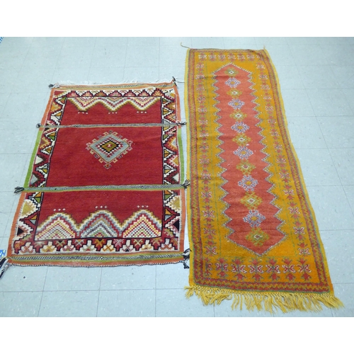 261 - Rugs: to include an Afghan example with geometric motifs, on an orange ground  39