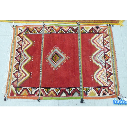 261 - Rugs: to include an Afghan example with geometric motifs, on an orange ground  39