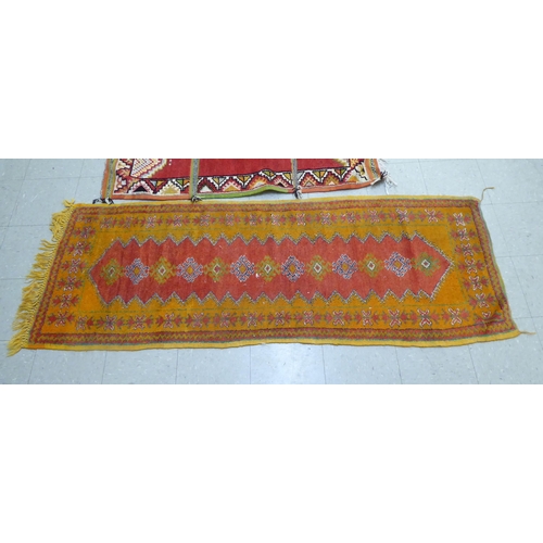 261 - Rugs: to include an Afghan example with geometric motifs, on an orange ground  39