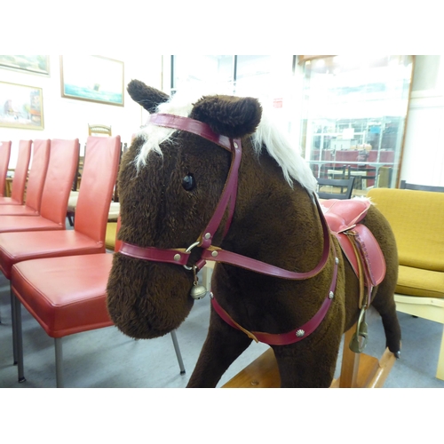 265 - A Pegasus fur fabric rocking horse, on a stained beech stand  39