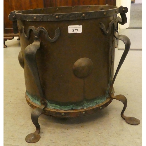 279 - An Arts & Crafts period cast and wrought iron bound, rivetted copper coal bin, raised on splayed... 