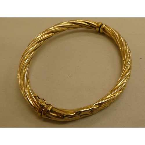 294 - A 9ct gold hollow ropetwist effect bangle